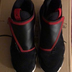 Men’s Jordan 10 1/2 black with red sneakers